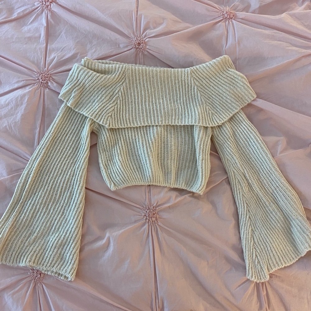 Cream colored knit off the shoulder sweater crop top with flare sleeves